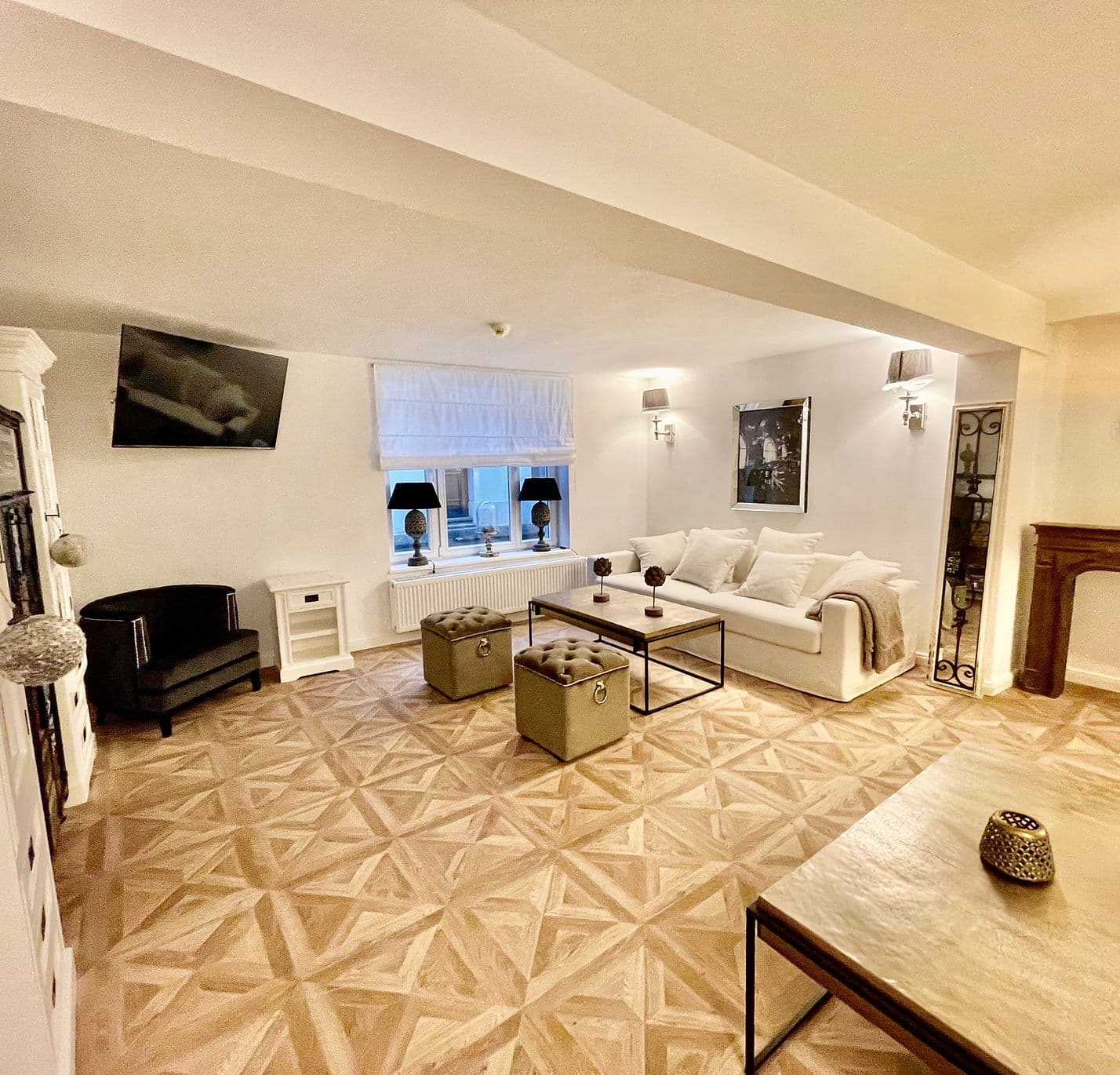 Cozy lounge room with a large sofa and TV